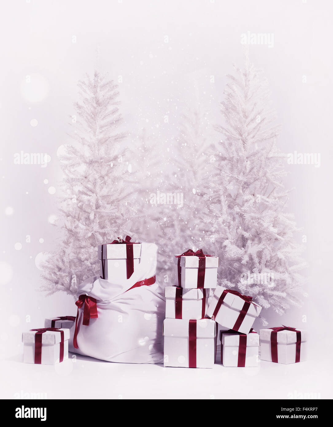 Christmas trees with bag and heap of gift boxes Stock Photo Alamy