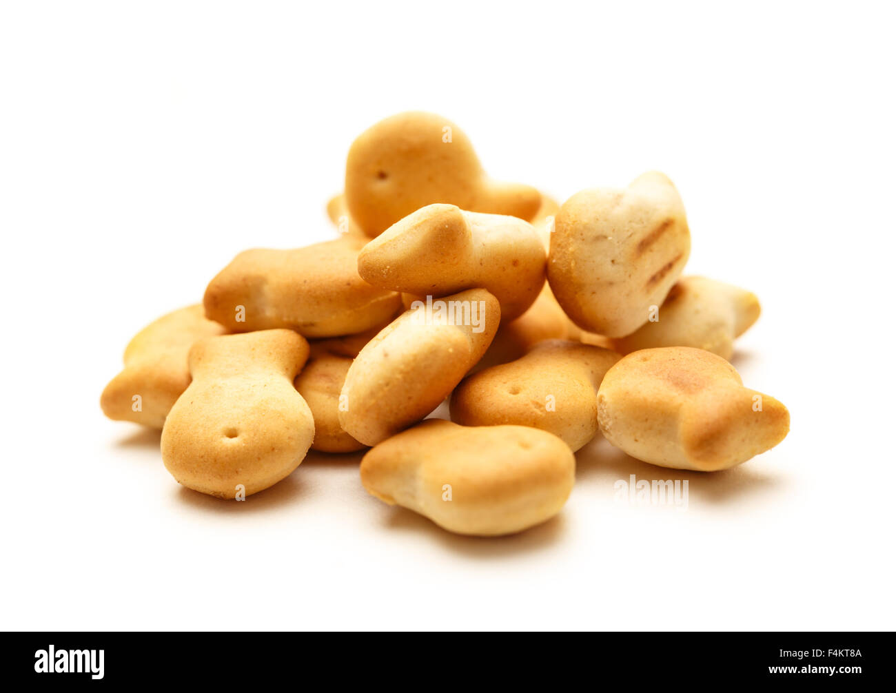 Salty crackers in shape of fish as background Stock Photo