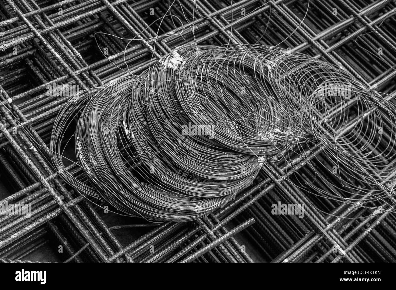 Coil of wire on construction rebar Stock Photo