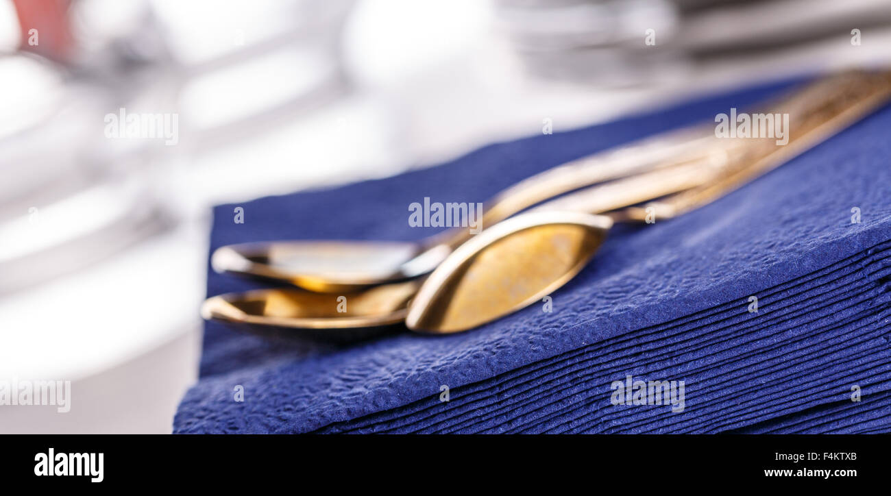 Stack of dark blue paper napkins with spoons Stock Photo Alamy