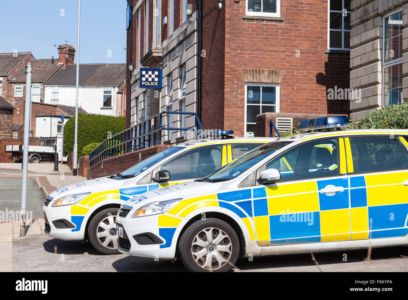 Police cars parked waiting outside Burslem Police Station Stoke-on-Trent Staffordshire England UK Stock Photo