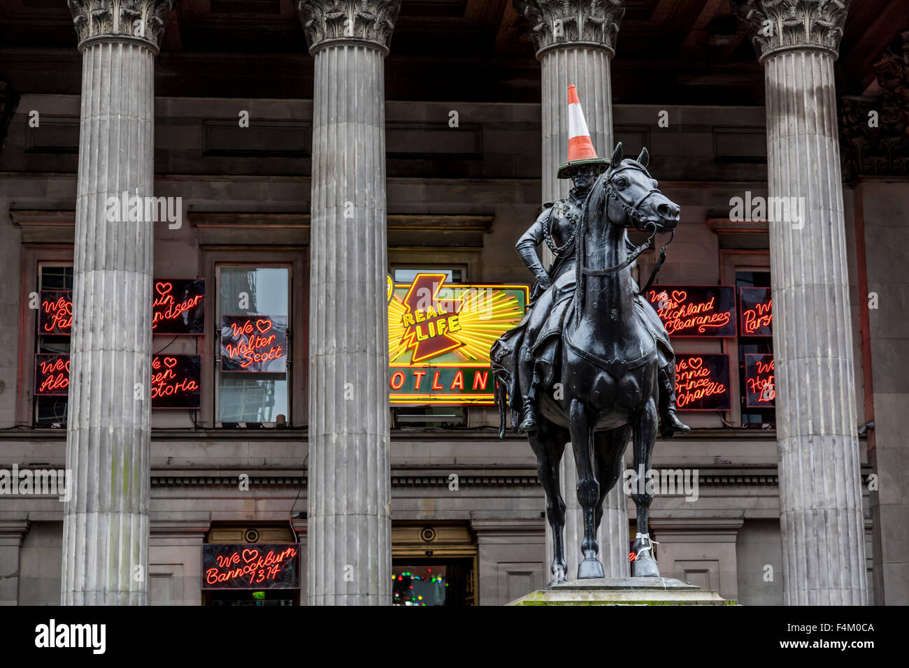Duke of Wellington Glasgow statue and traffic cone, Gallery of Modern Art, Glasgow city centre, Royal Exchange Square / Queen Street, Scotland, UK Stock Photo