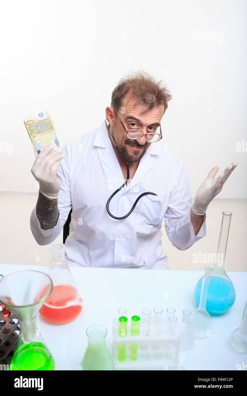 Mad chemist in the lab doing reaction Stock Photo - Alamy