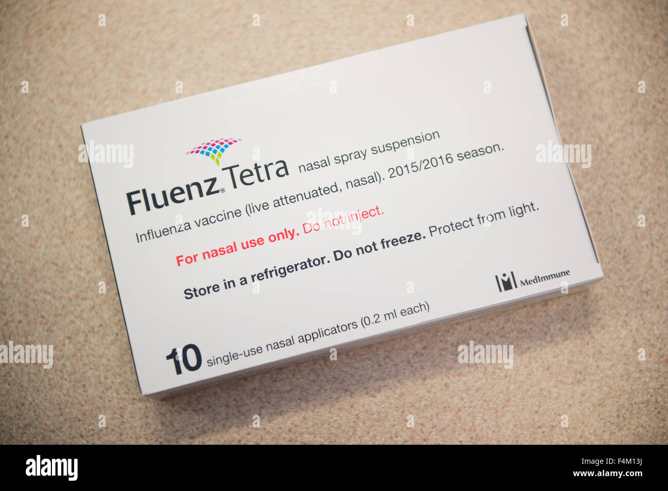 A Packet pack  of 10 doses of Fluenz Tetra influenza flu nasal spray vaccine  for treating children at a primary school ahead of the 2105/2106 winter , UK Stock Photo