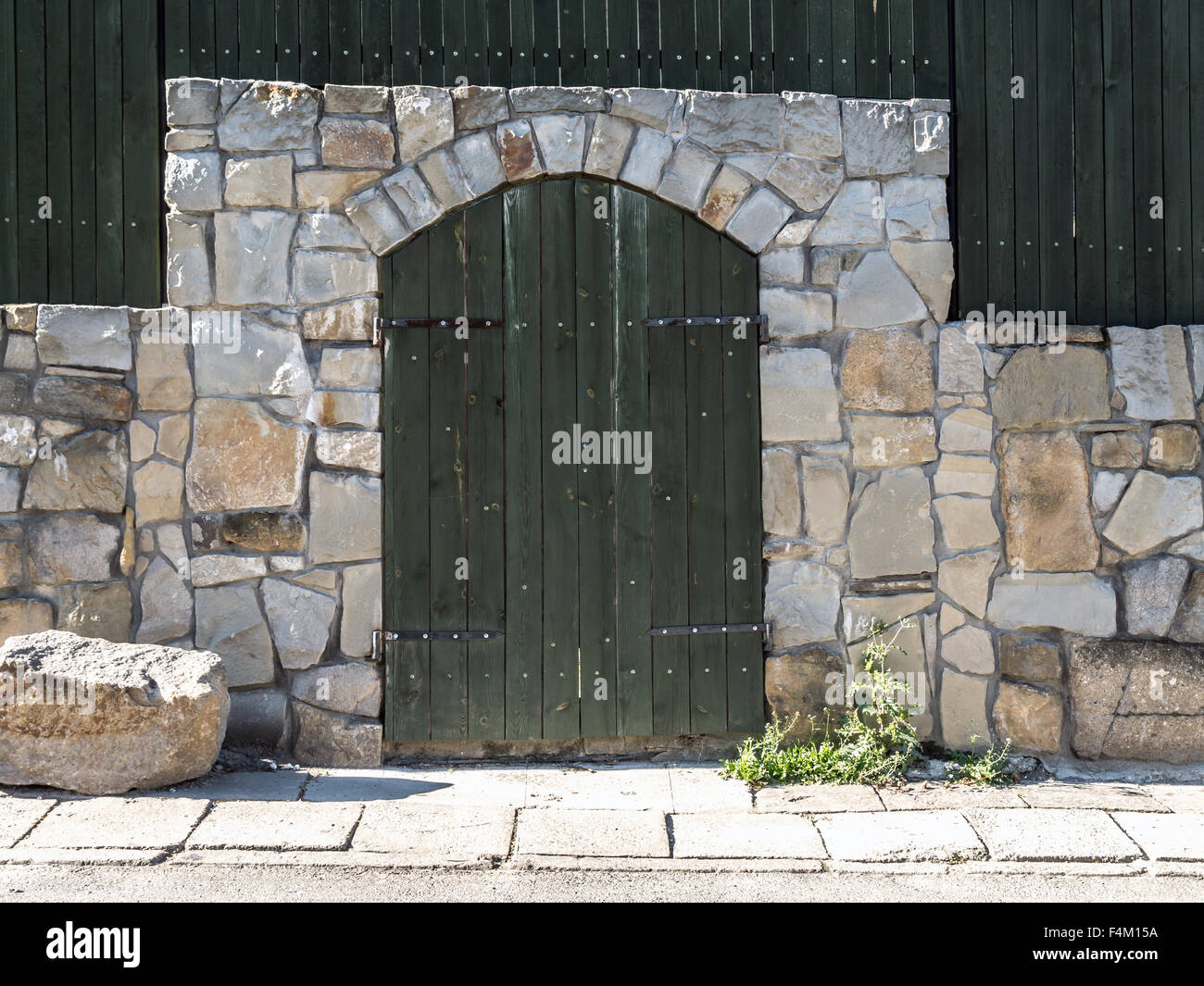 Wooden doorway with stone framing Stock Photo