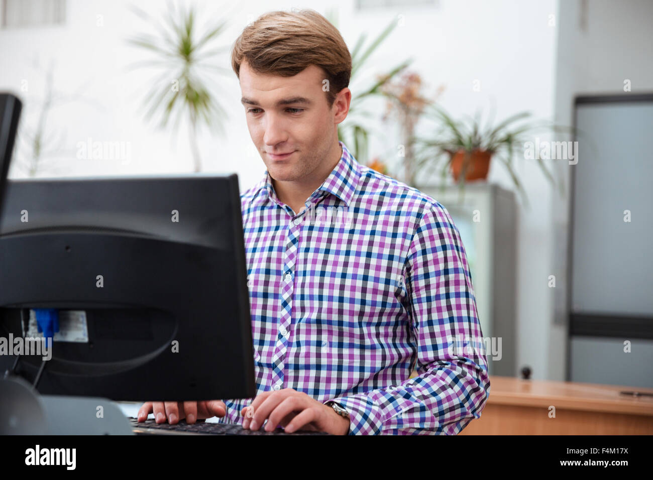 Portrait of a male student using computer in university Stock Photo - Alamy