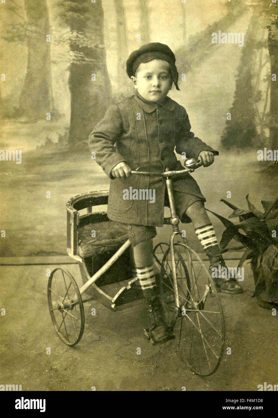 Child on tricycle, Italy Stock Photo Alamy