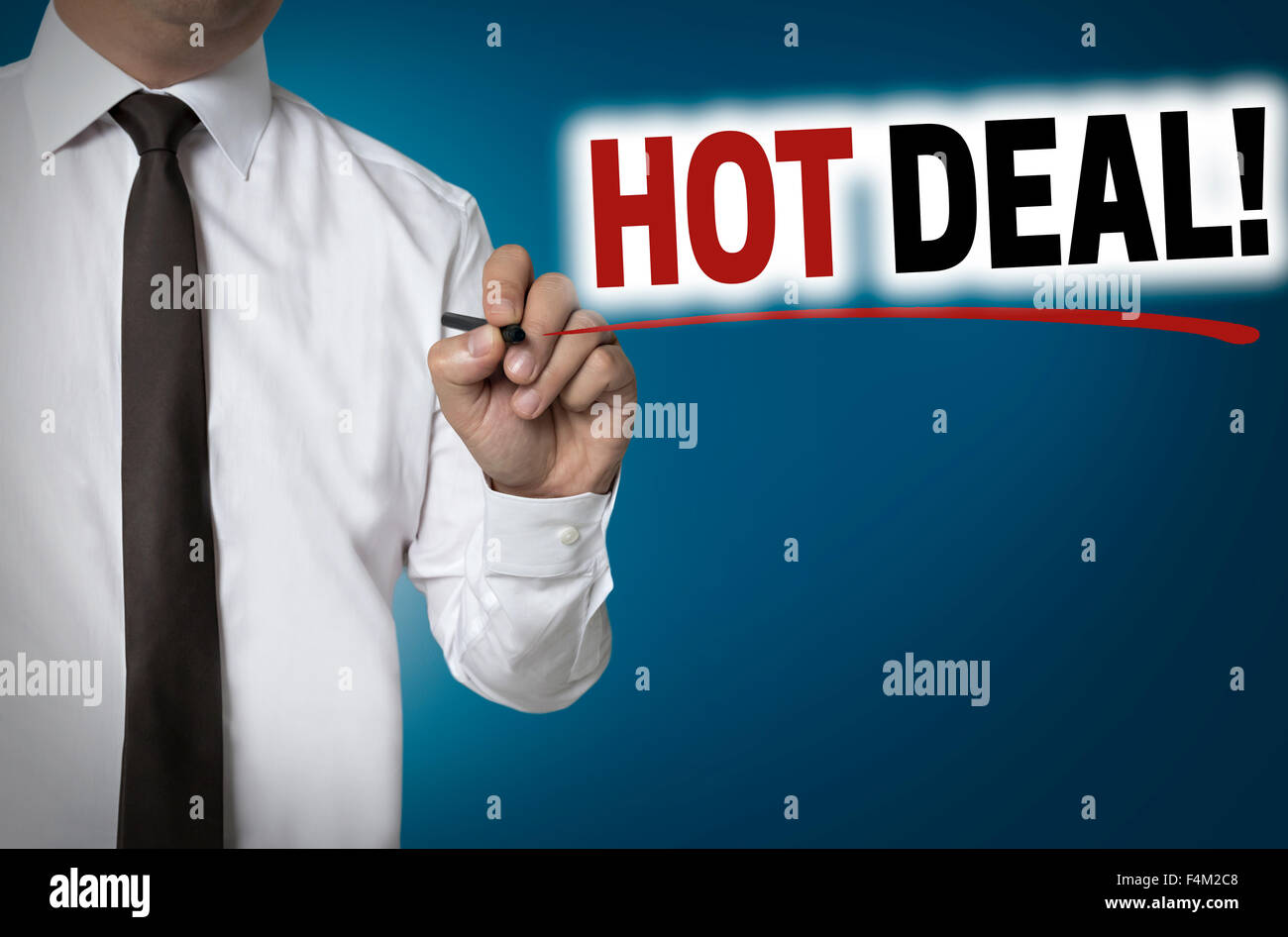 Hot deal is written by businessman background concept. Stock Photo