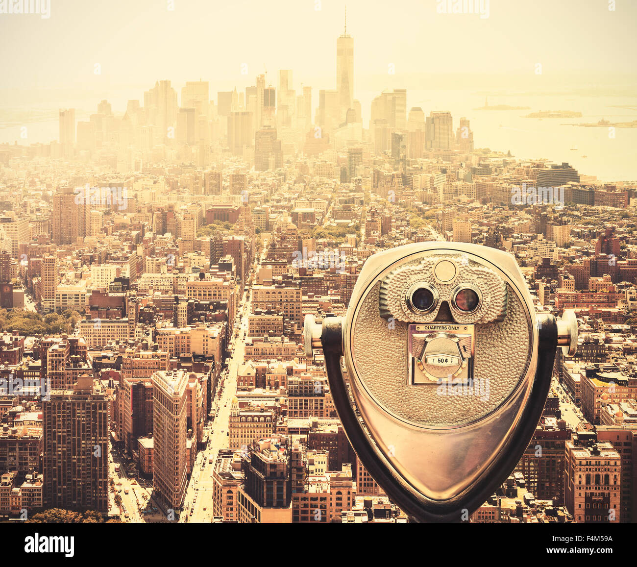 Retro vintage toned tourist binoculars over Manhattan Skyline, New York City, USA. Stock Photo