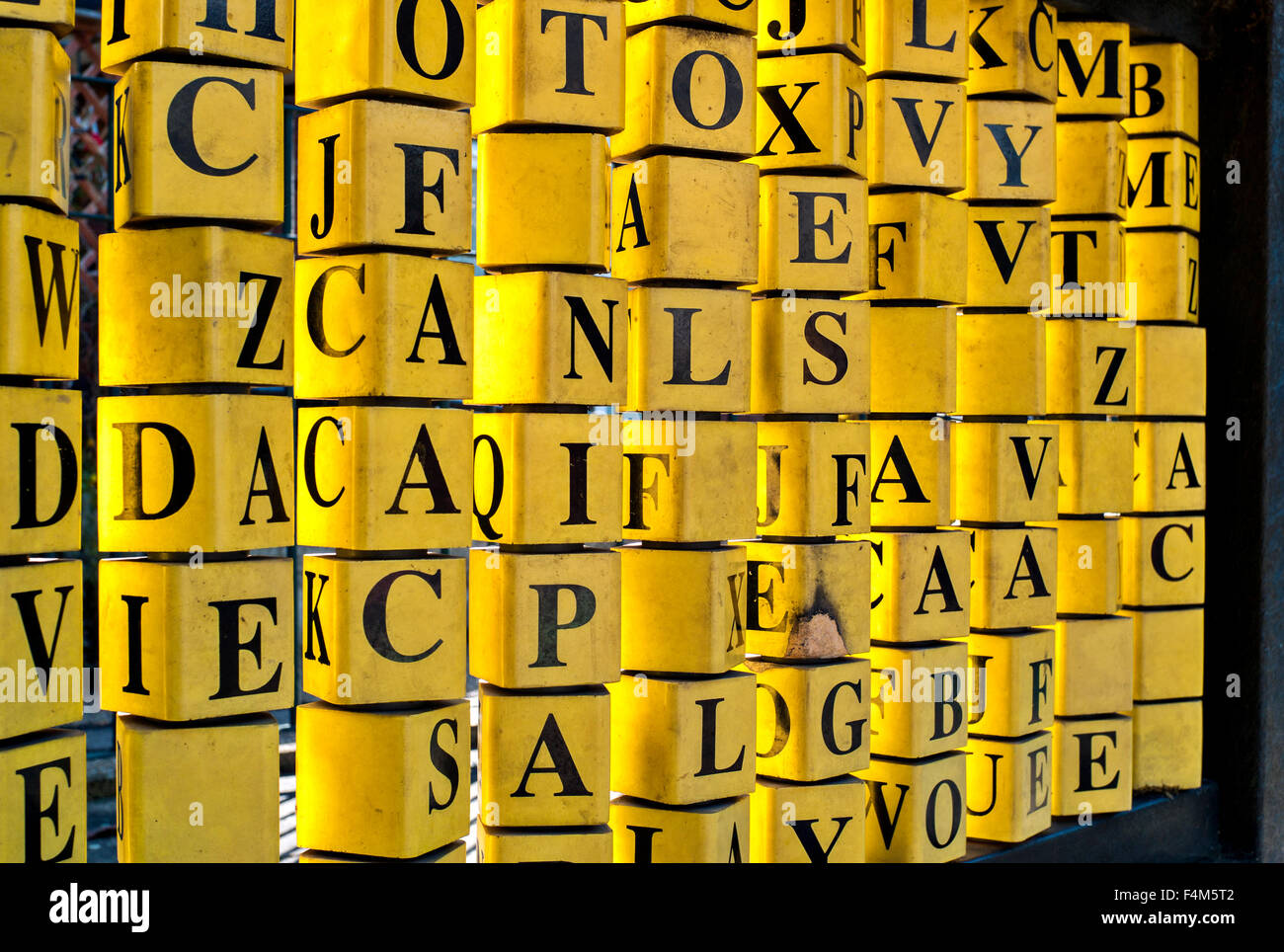 Children's public playground yellow alphabet blocks, rotating learning  letters installation, Alphabet Abacus Stock Photo - Alamy