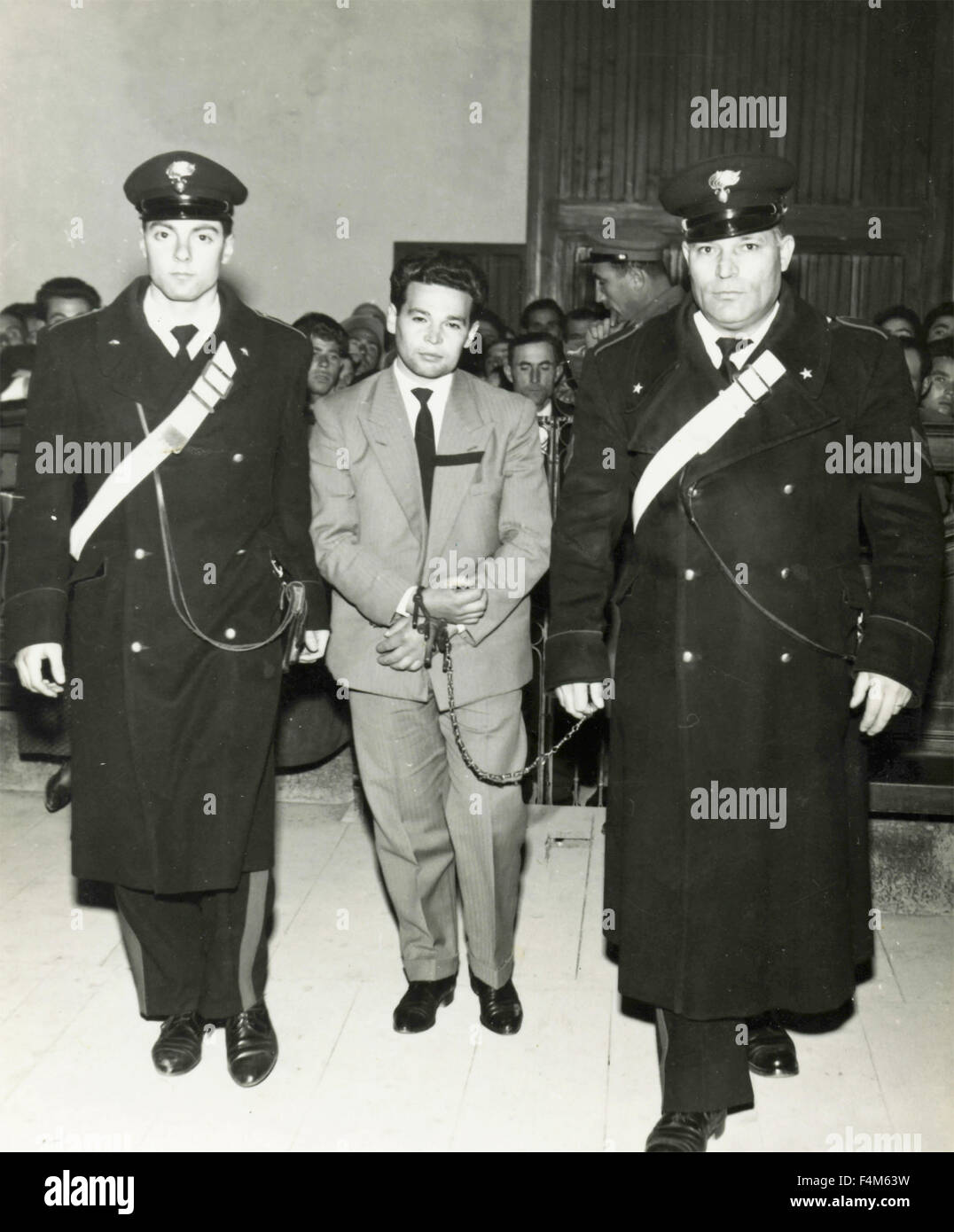 Sentenced man escorted in handcuffs by the Italian Carabinieri Stock