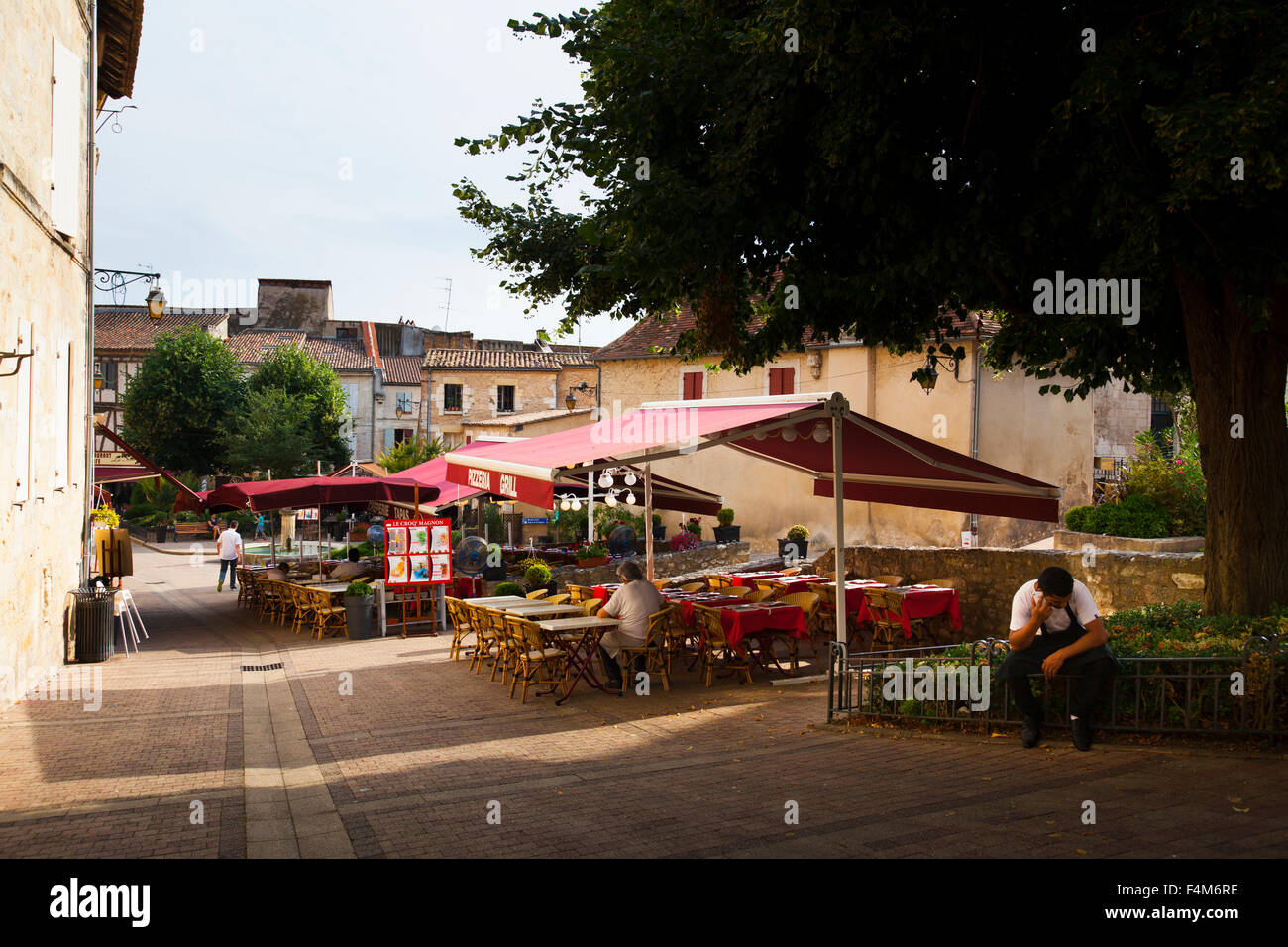 Street restaurant tables in  France before the evening rush Stock Photo