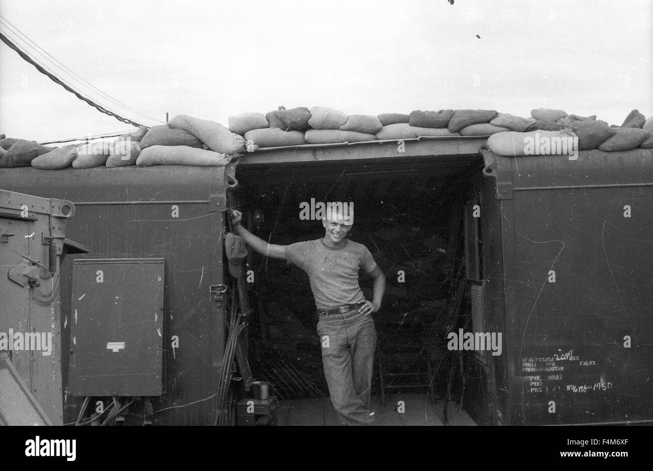 Soldier at a First Infantry Division base camp in 1965 during the Vietnam War. Stock Photo