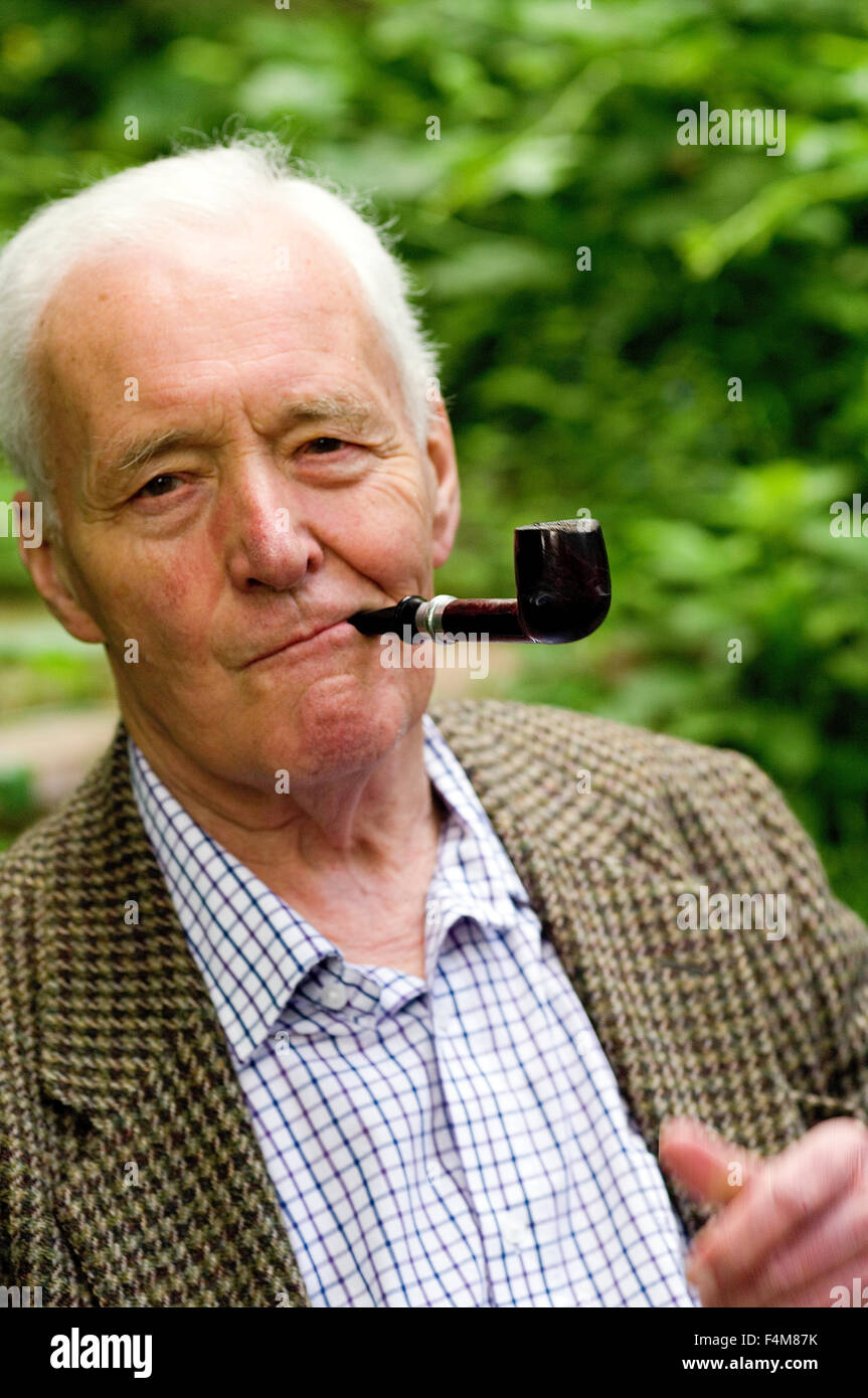 Tony Benn smoking a pipe in Abney Park Cemetary prior to speaking at the Stoke Newington Literary Festival Stock Photo