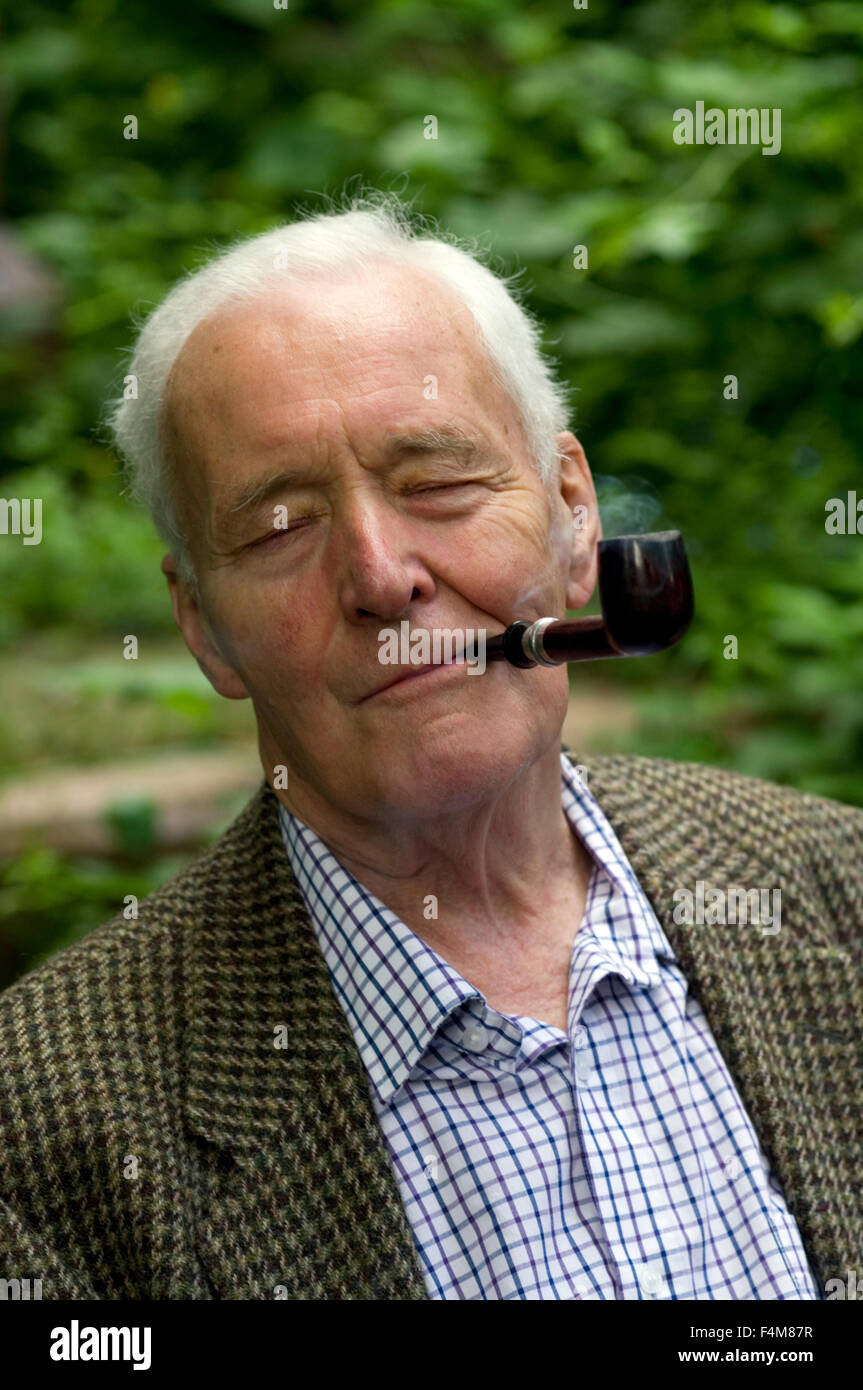 Tony Benn smoking a pipe in Abney Park Cemetary prior to speaking at the Stoke Newington Literary Festival Stock Photo