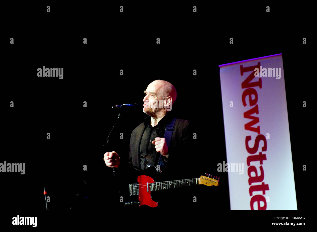 Wilko Johnson performing at the Stoke Newington Literary Festival in Stoke Newington, New Statesman banner behind him Stock Photo