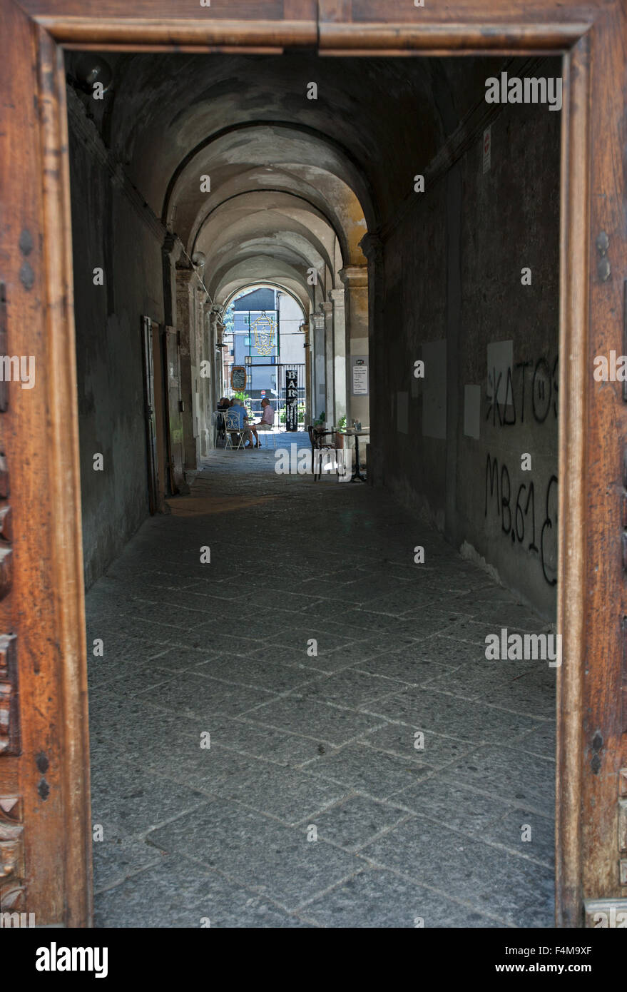 Café Bar in ally, tunnel view, cobble stones, door frame, Florence Italy, Stock Photo