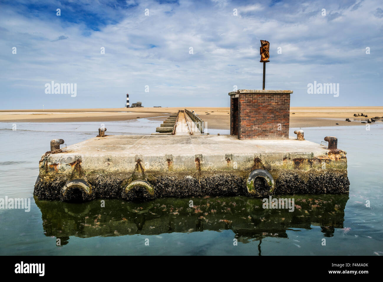 Small stone dock by the Pelican Point Lodge, Walvis Bay, Namibia, Africa Stock Photo