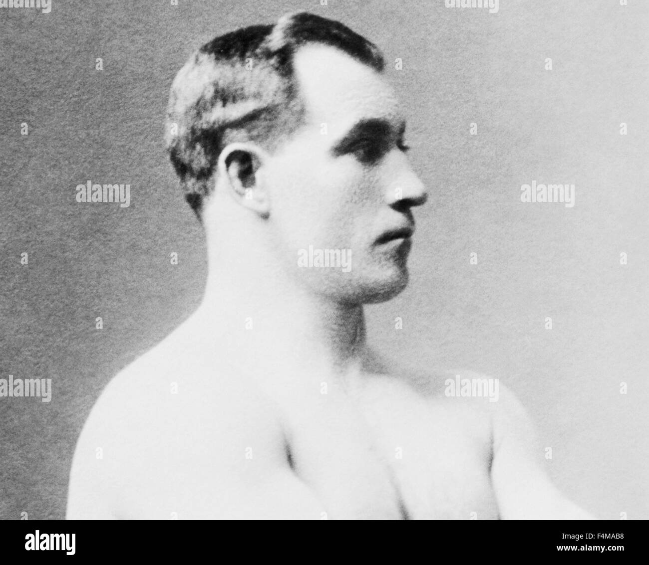 Vintage photo of heavyweight boxer 'Sailor' Tom Sharkey (1873 - 1953). Sharkey, born in Dundalk, Ireland, ran away from home at a young age and went to sea as a cabin boy, eventually arriving in New York City in 1892 and joining the US Navy. He began his boxing career after being deployed to Hawaii and went on to have more than 50 bouts - fighting some of the great champions of the era including Jim Corbett, Bob Fitzsimmons and Jim Jeffries. Despite never winning the world heavyweight crown Sharkey is generally regarded as one of the great fighters of his time. Stock Photo