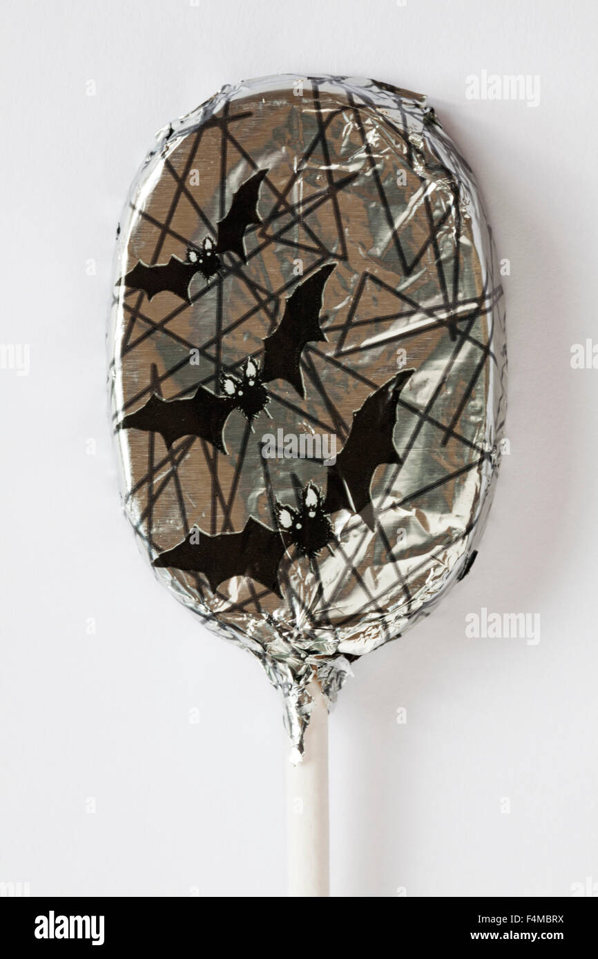 M&S spooky chocolate lolly foil wrapped with flying bats design ready for Halloween set on white background Stock Photo