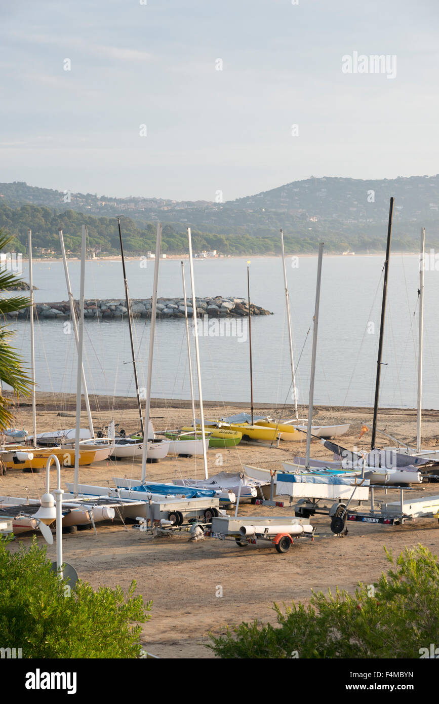 Small sailing boats or dinghies parked on the beach at Cavalaire
