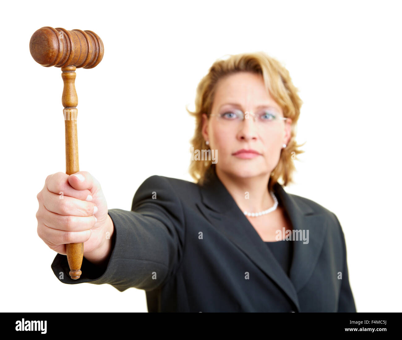 Female judge in jacket holding wooden hammer Stock Photo - Alamy