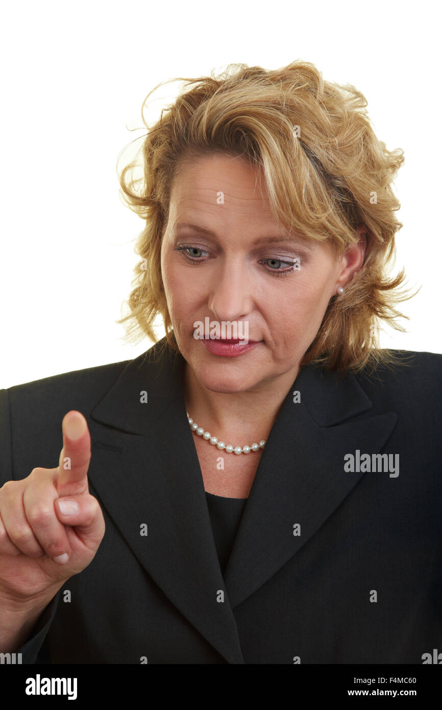 Business woman pressing her finger on a glass plate Stock Photo