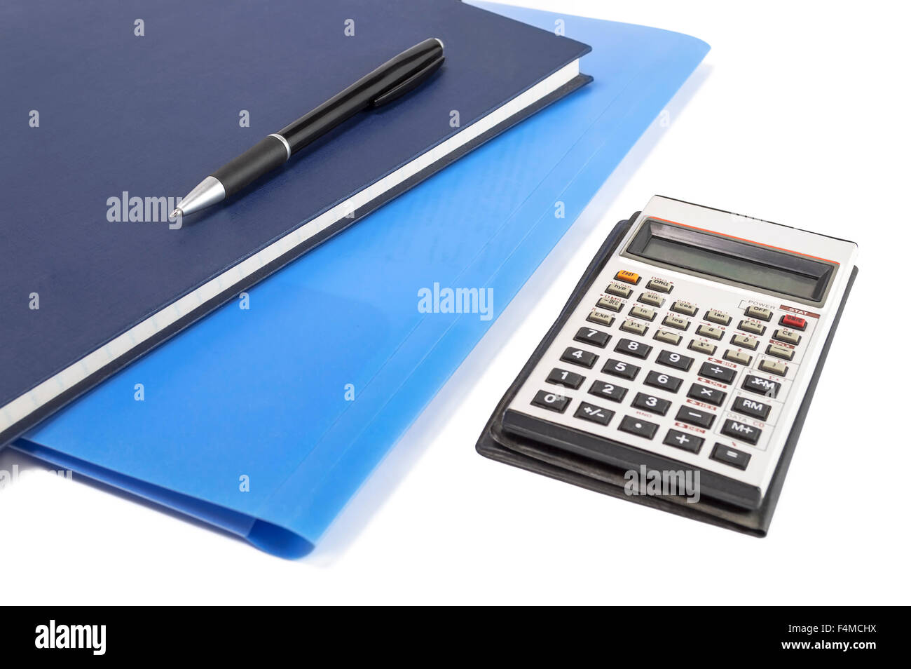 Two blue diary with pen and calculator. Selective focus. Stock Photo