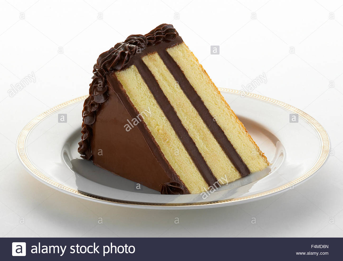 Slice Of Vanilla Cake With Chocolate Frosting Stock Photo 88959885