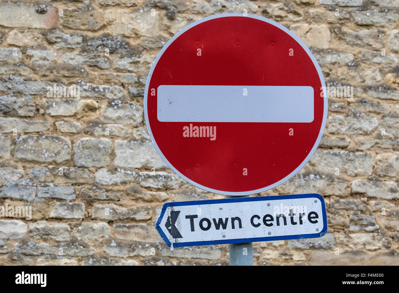 Pointing the way to the town centre via a no entry sign, England, UK Stock Photo