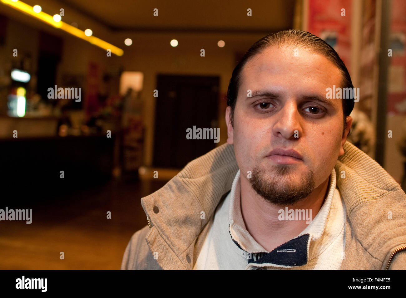 Berlin, Germany. 19th Oct, 2015. Guantanamo torture victim Mourad Benchellali sits in the lobby of a cinema in Berlin, Germany, 19 October 2015. The former inmate of the Guantanamo Bay detention camp met with representatives of Amnesty International and Human Rights Watch at this location to discuss further proceedings in his and other similar cases and took part in a panel discussion. Photo: Klaus-Dietmar Gabbert/dpa/Alamy Live News Stock Photo