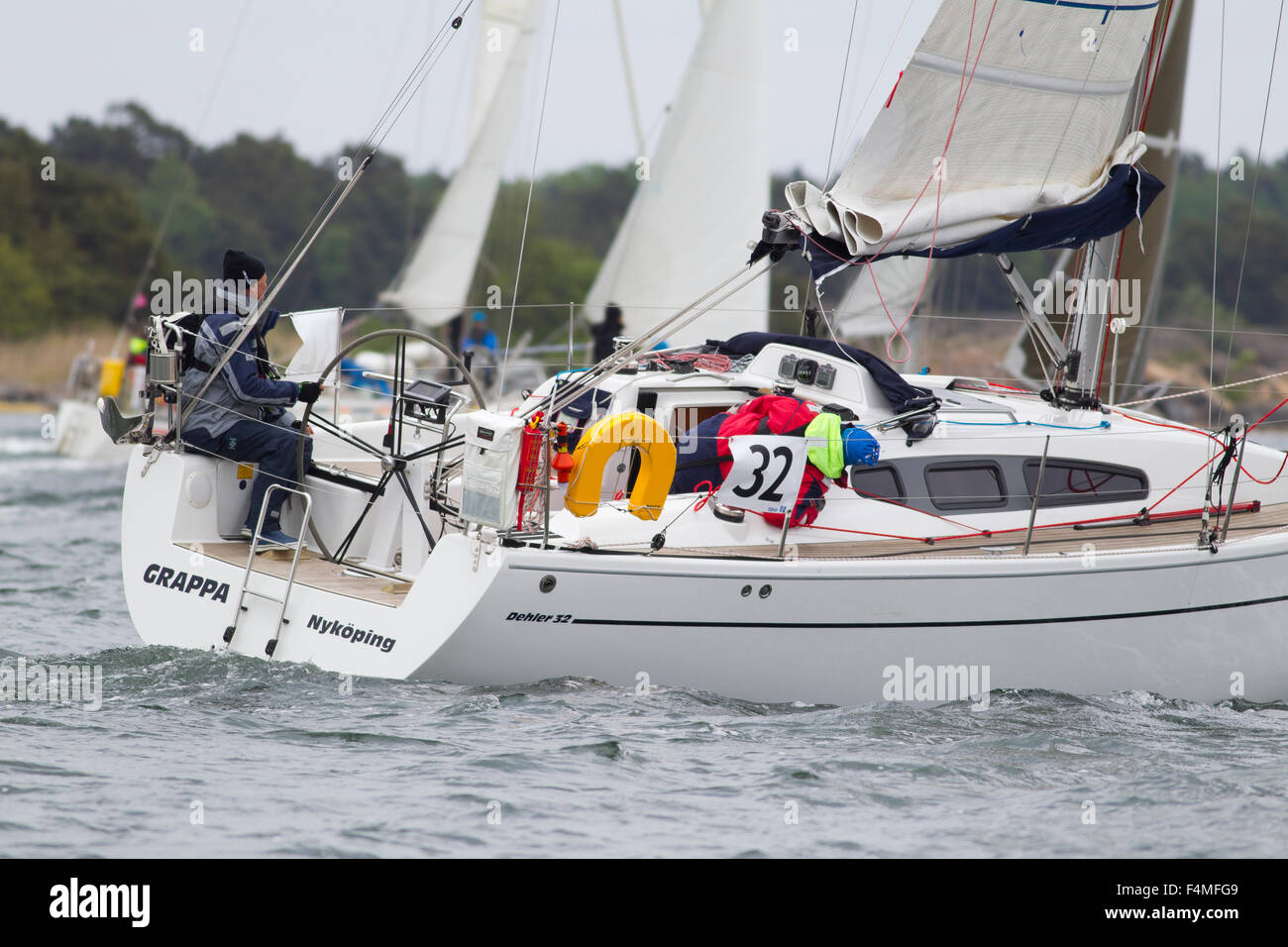 A large sailboat passes in cold weather Stock Photo