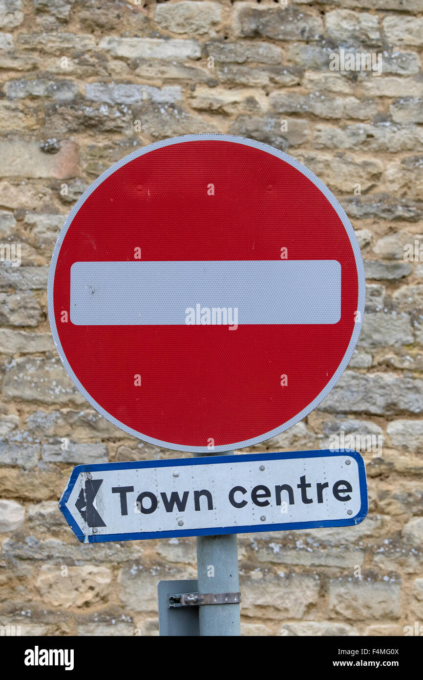Pointing the way to the town centre via a no entry sign, England, UK Stock Photo