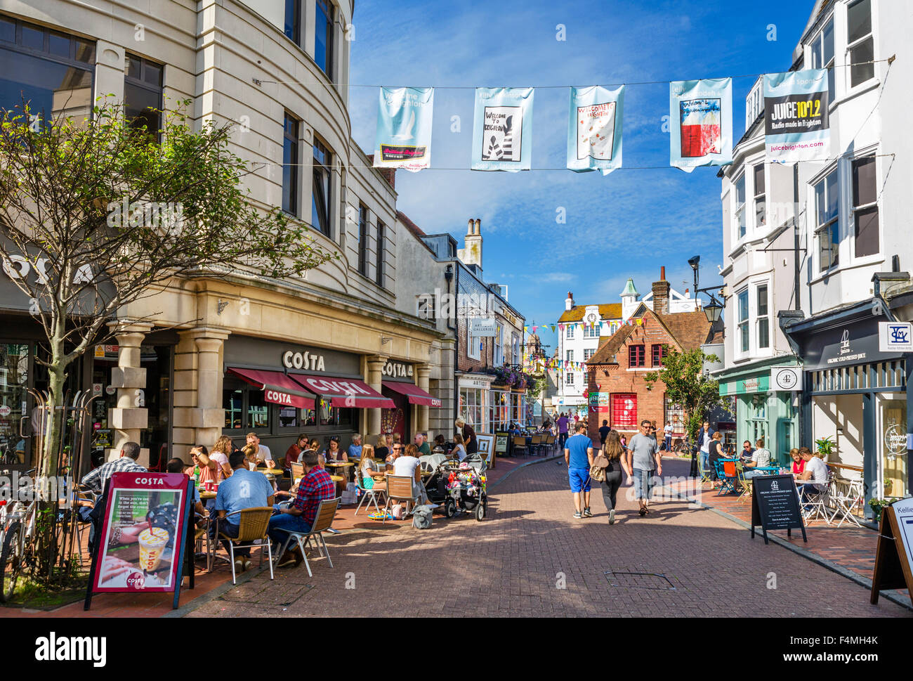 Cafes, bars, restaurants and shops on Market Street looking towards Dolphin Place,The Lanes, Brighton, East Sussex, England, UK Stock Photo
