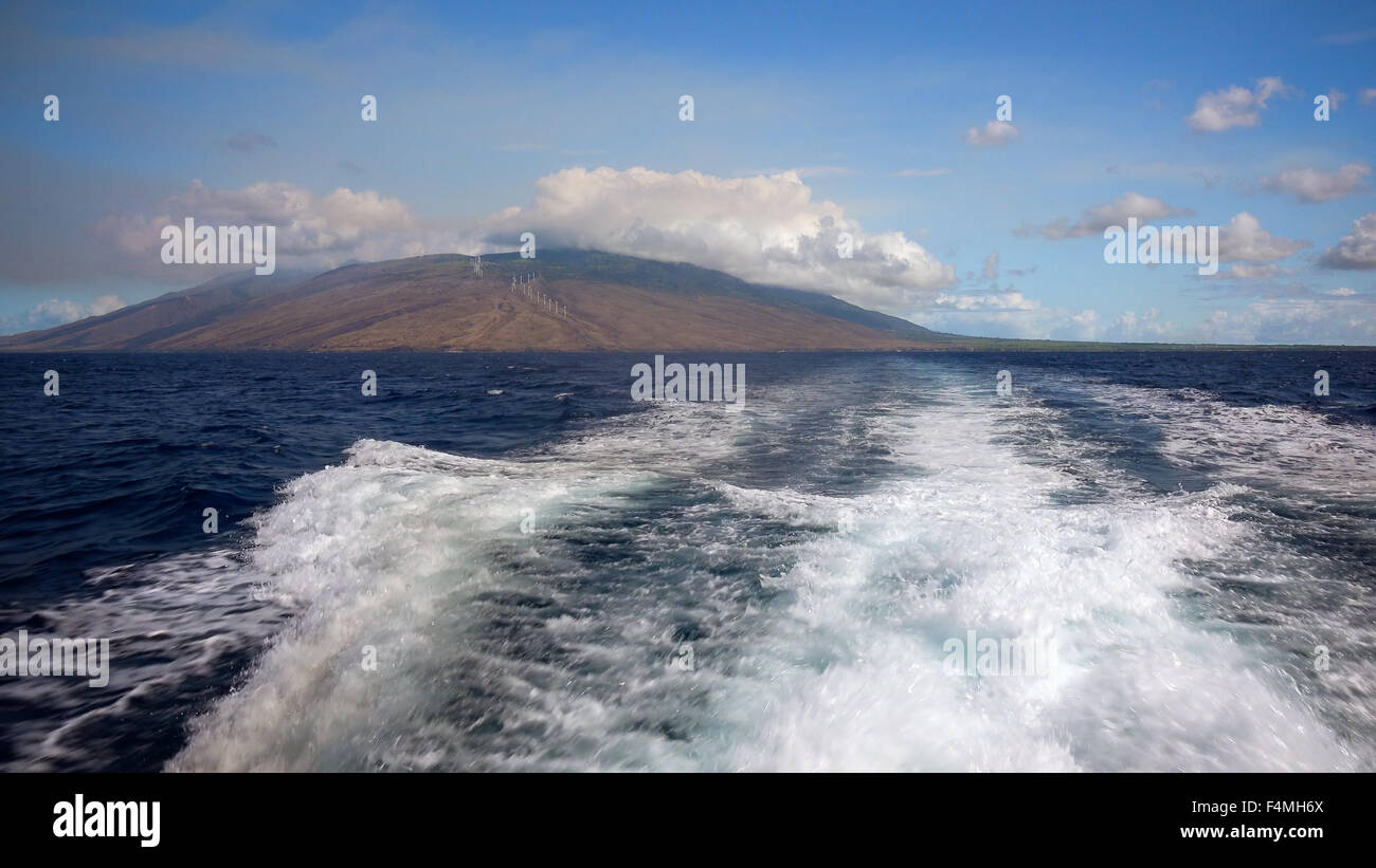 Wake of a dive boat as it makes its way off the coast of Maui heading toward the Molokini Crater a popular dive and snorkel dest Stock Photo