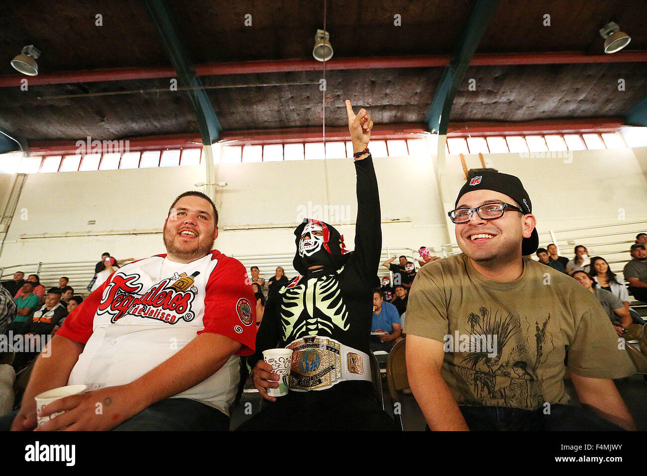 Napa, CA, USA. 17th Oct, 2015. Denny Pena, Alexis Saldivar, dressed as the famed luchador ''la Parka'' and Samuel Urena cheer during the Napa Lucha Libre at the Expo on Saturday night. © Napa Valley Register/ZUMA Wire/Alamy Live News Stock Photo