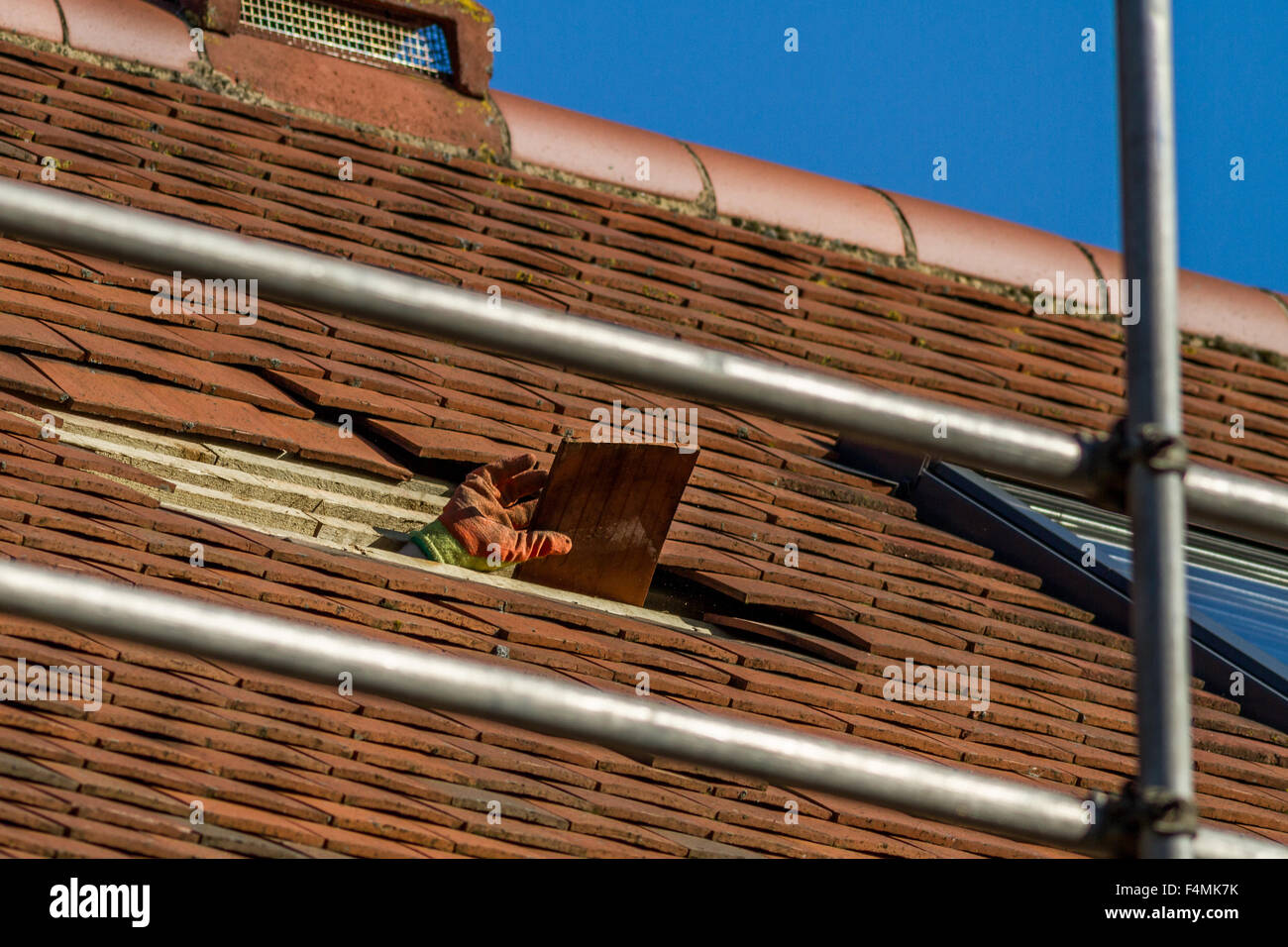 Creating a window in the roof of a loft conversion Stock Photo