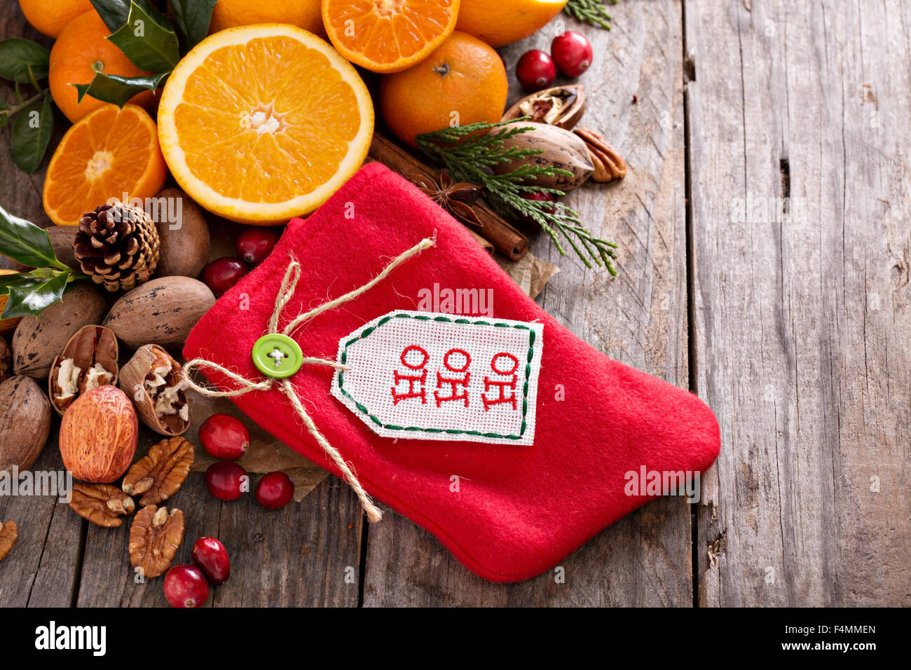 Winter and christmas ingredients still life with oranges, cranberry, nuts and spices and a