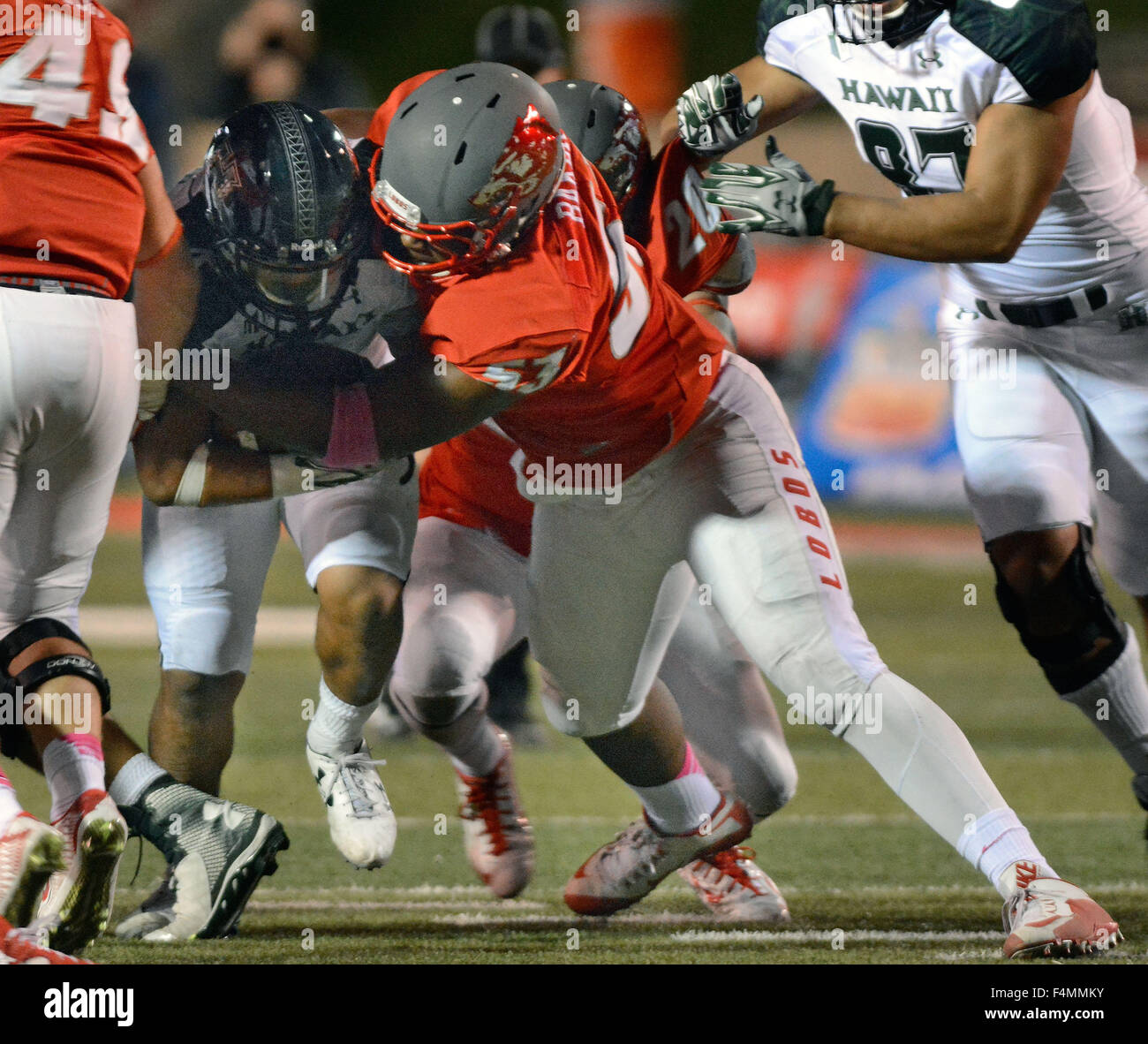 Albuquerque, NM, USA. 17th Oct, 2015. UNM's #53 Cody Baker wraps up the ball carrier in their game against Hawaii. Saturday, Oct. 17, 2015. © Jim Thompson/Albuquerque Journal/ZUMA Wire/Alamy Live News Stock Photo