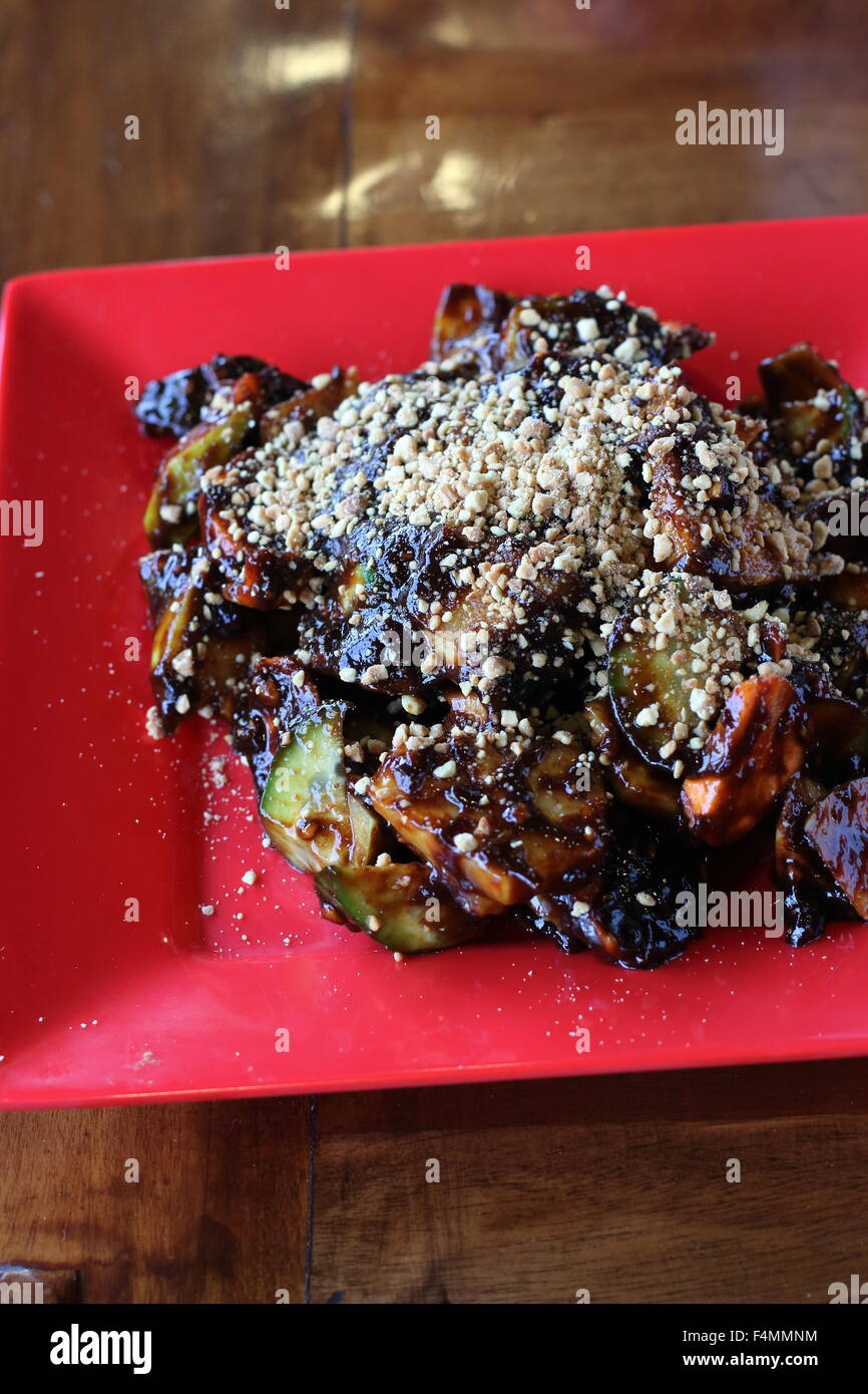 Fruit and vegetable Rojak with crushed nuts on top Stock Photo