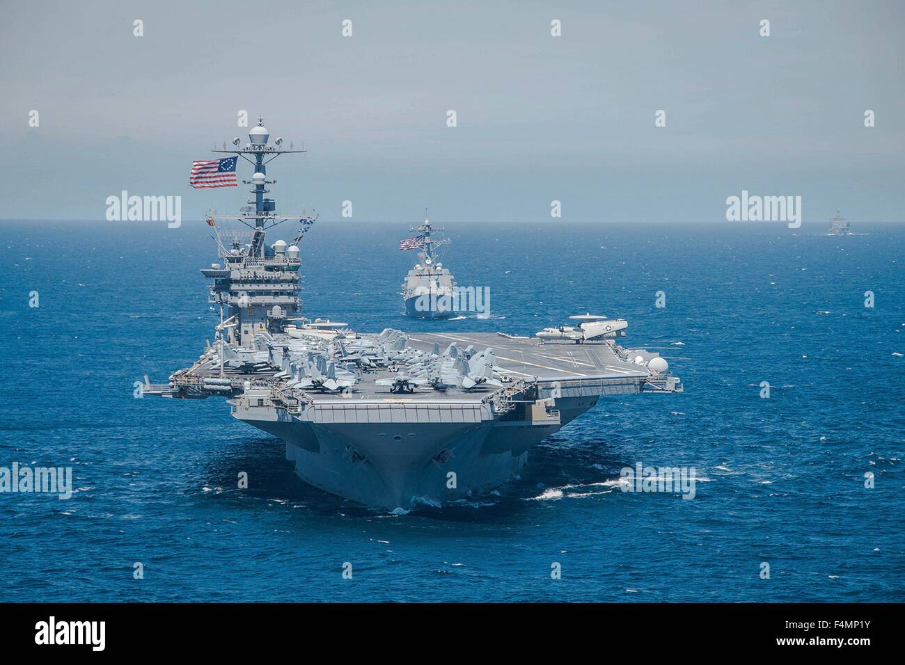 US Navy Nimitz-class aircraft carrier USS George Washington leads a formation of warships during exercise UNITAS October 17, 2015 in the Pacific Ocean. Stock Photo