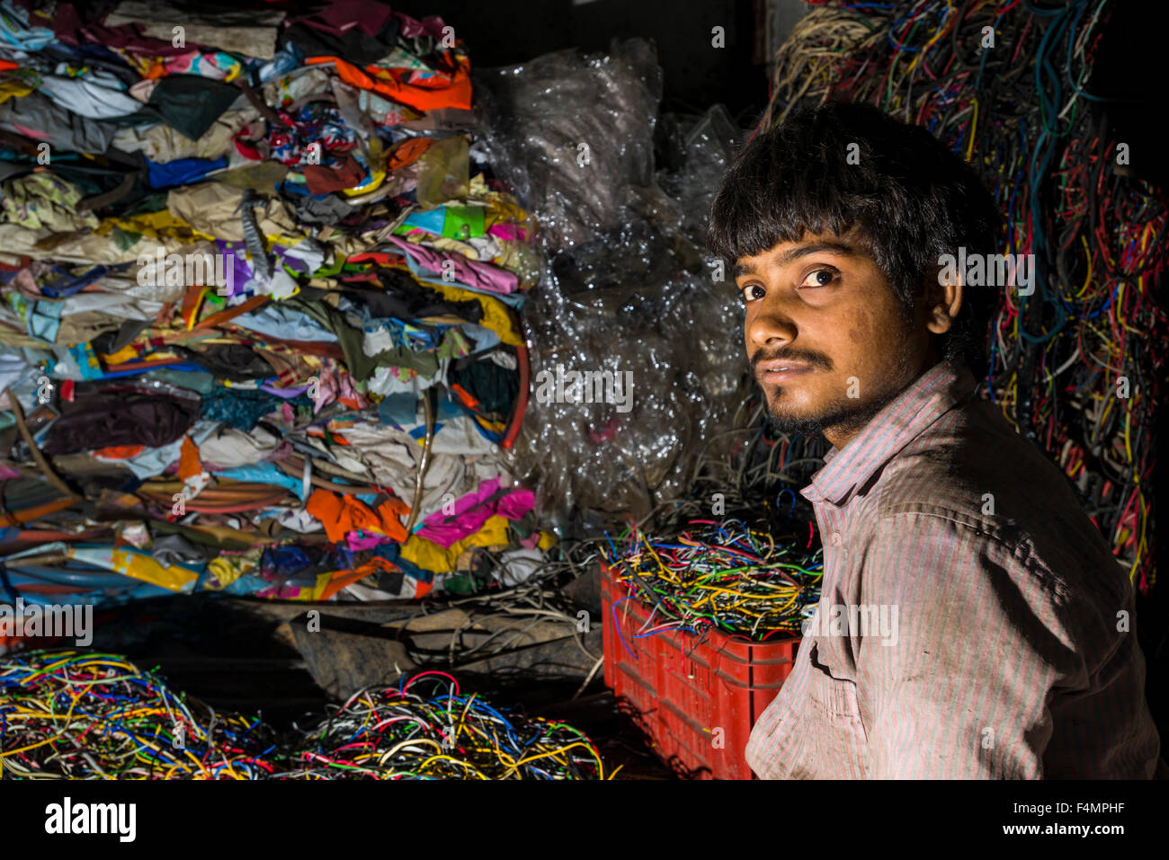 A portrait of a worker. About 10.000 labour are working in 800 little companies, mainly in the garbage recycling business, at Dh Stock Photo