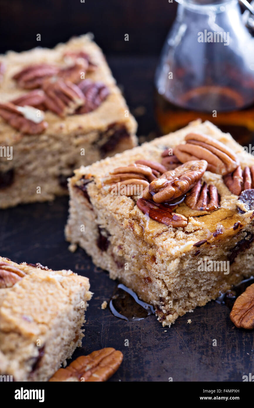 Pecan and dark chocolate blondies bar cookies with syrup Stock Photo