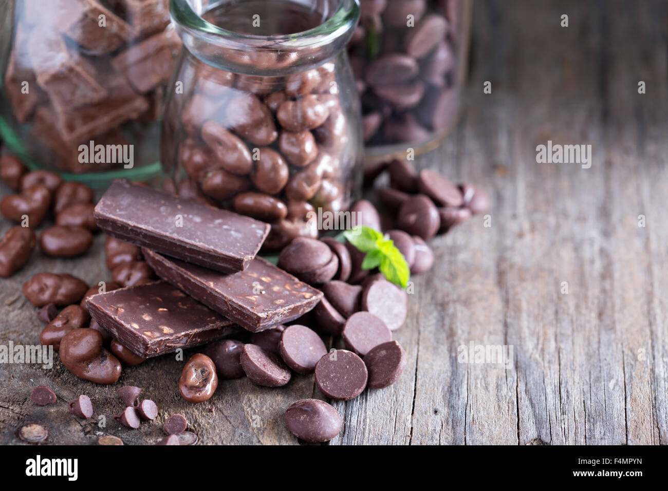 Chocolate pieces, chips, candies and bars in jars Stock Photo Alamy
