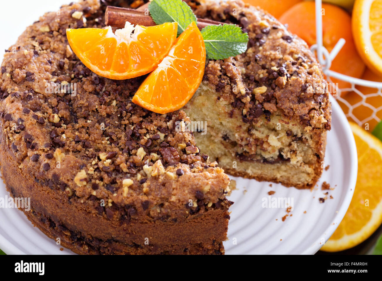 Coffee cake with oranges, nuts and chocolate with crumble topping Stock