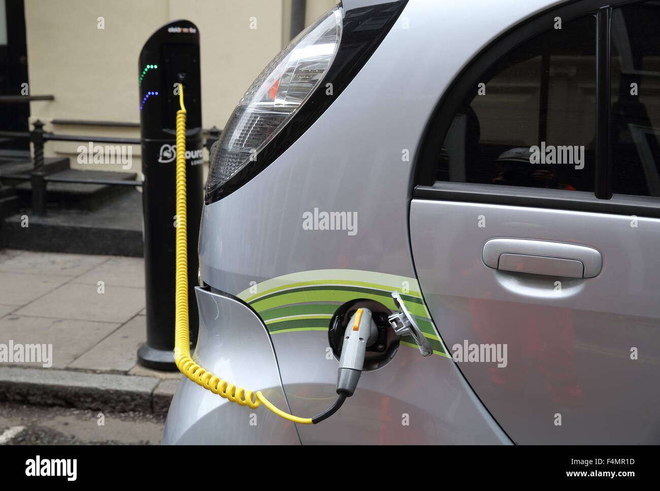 Parked vehicle being charge hires stock photography and images Alamy