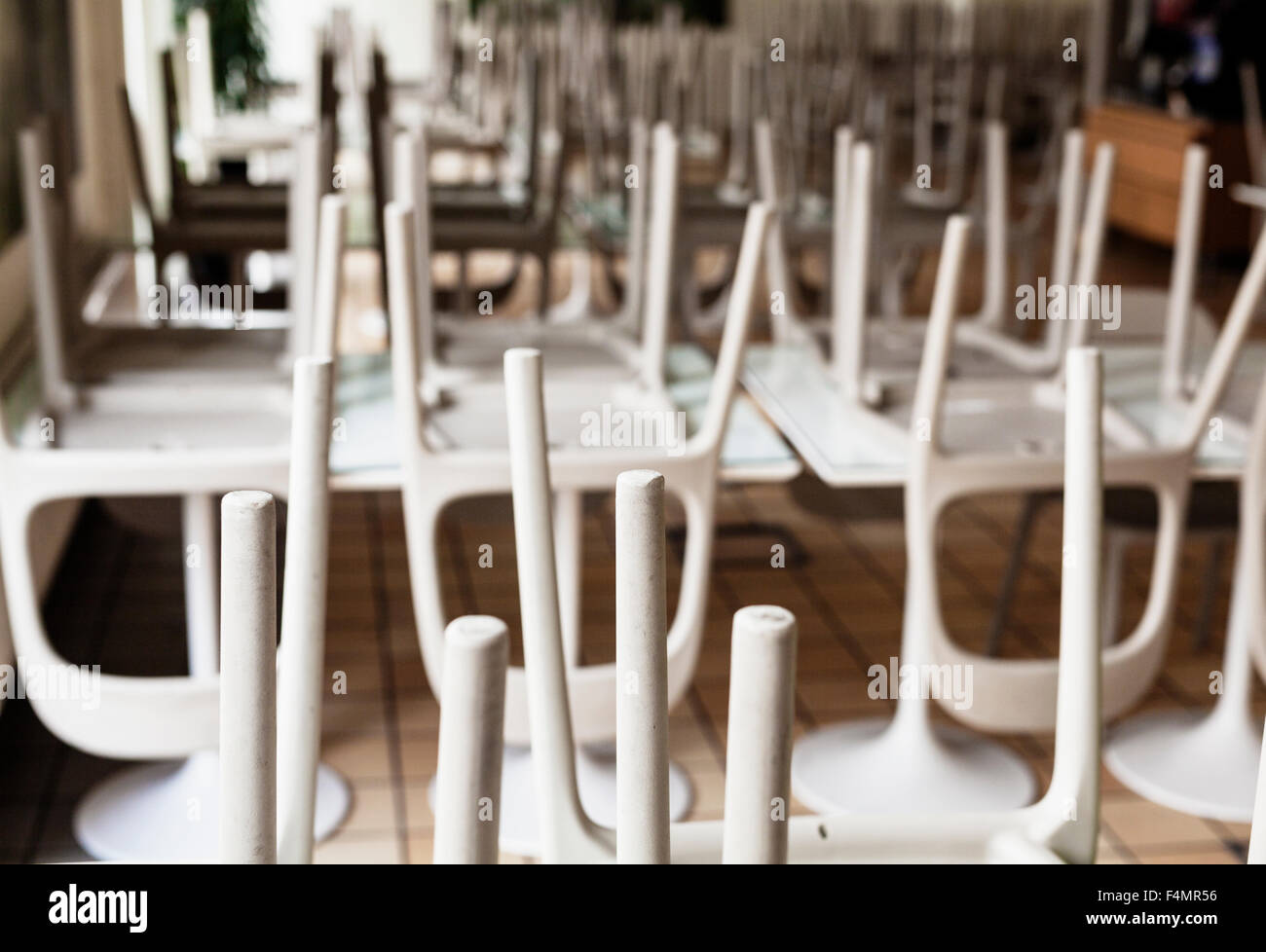 Upside down chairs on table at office cafeteria Stock Photo Alamy