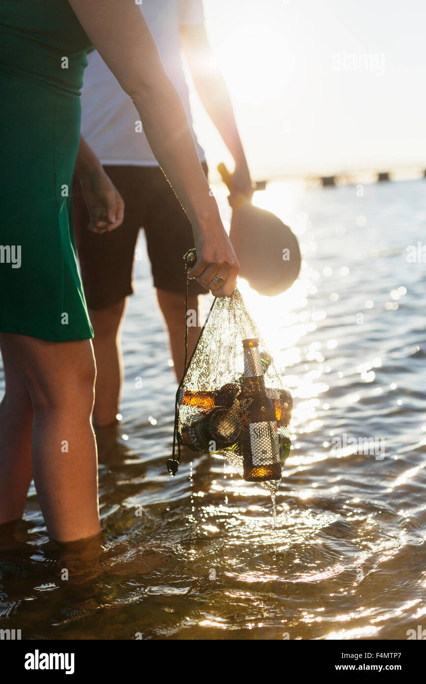 Hand holding two bottles beer hires stock photography and images Alamy