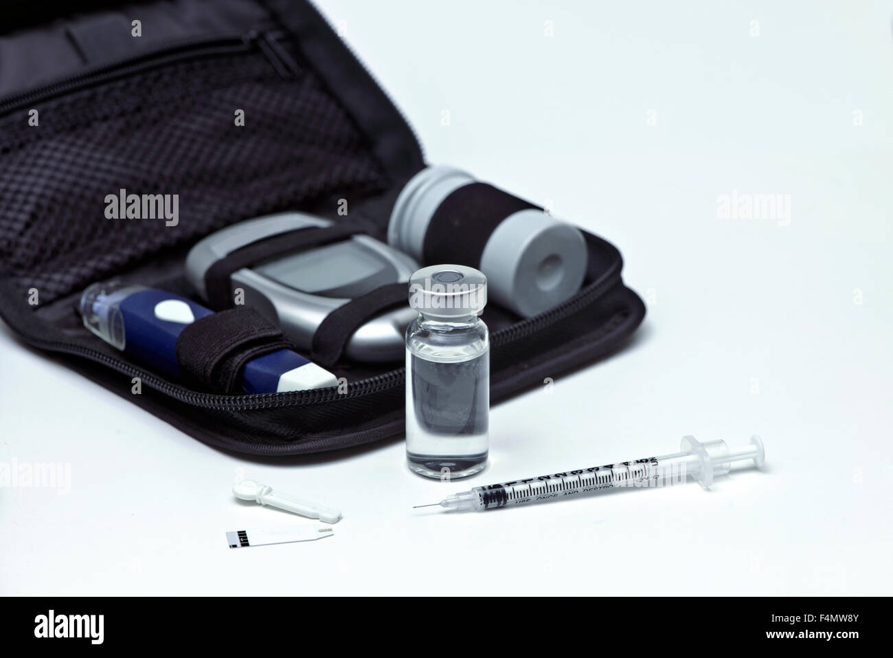 Insulin vial, syringe, lancet, strip and diabetic travel kit case. Stock Photo