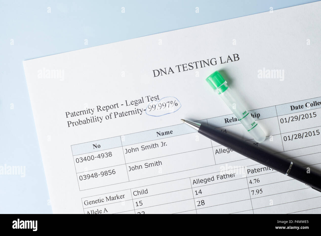 Paternity test results with pen and lab sample. Stock Photo